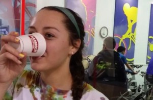 Triathlon participant drinking hammer